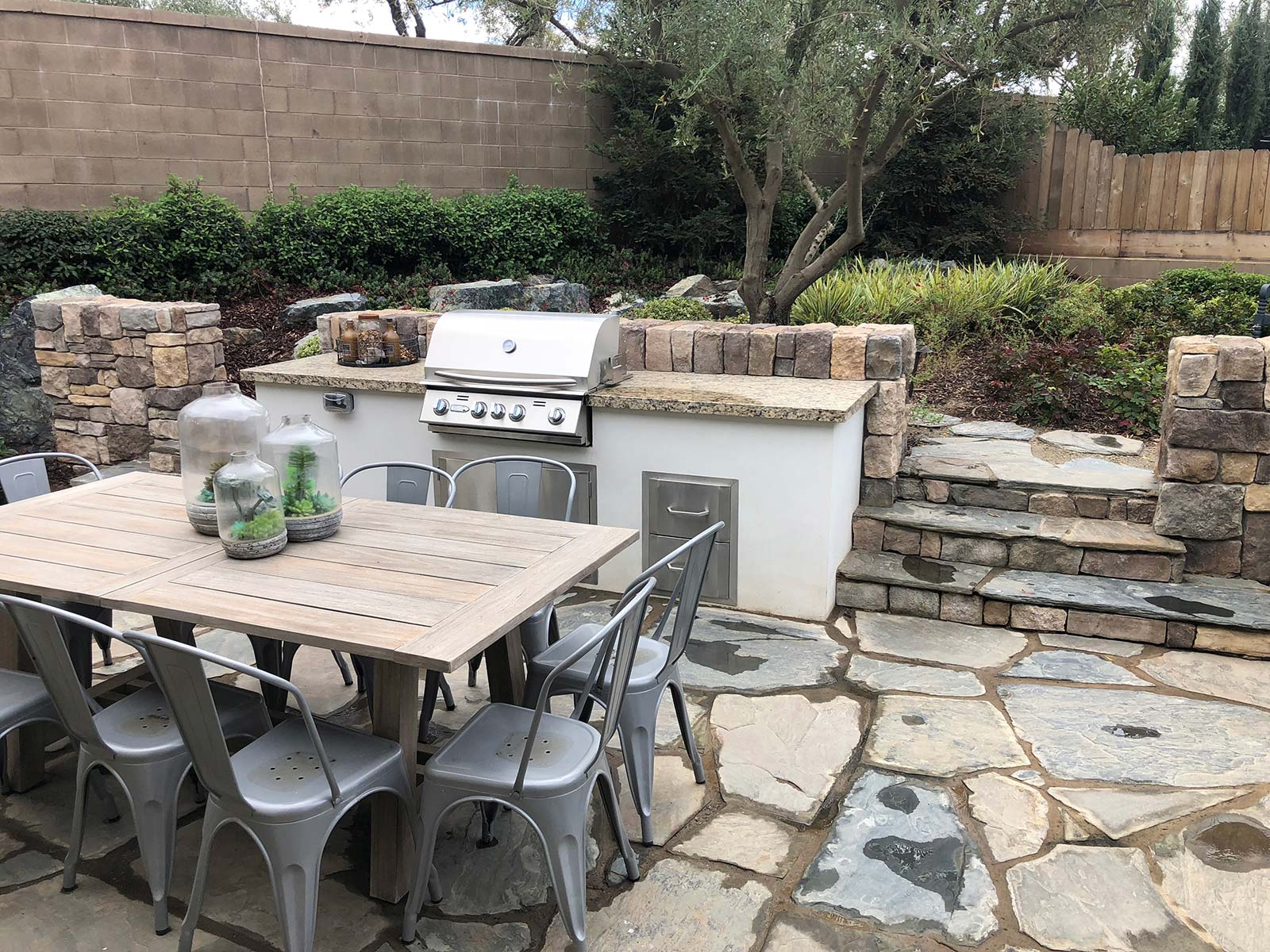 custom outdoor kitchen and sitting area